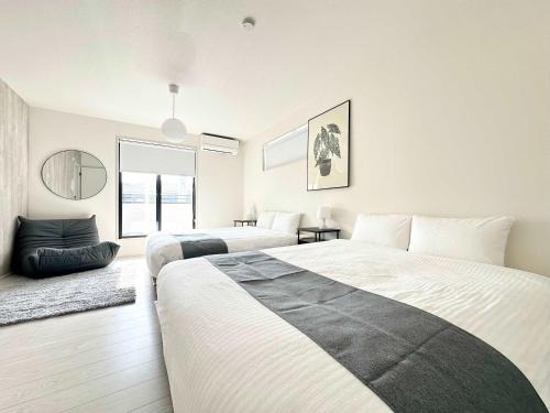 Ozu Apartment | 10 mins to kumamoto airport Spacious 4BR House by Restavio