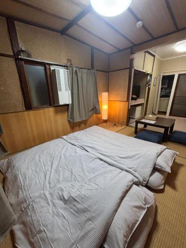 Suminoe Apartment | BUNKA HOUSE TATAMI ROOM a