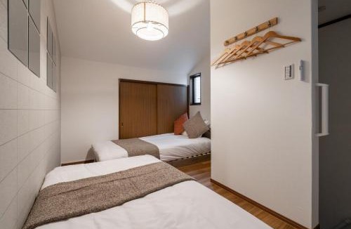 Fukushima Villa | ステイワン SOsaka 大阪駅まで1分 寝室4部屋ベッド7台 最大11名利用
