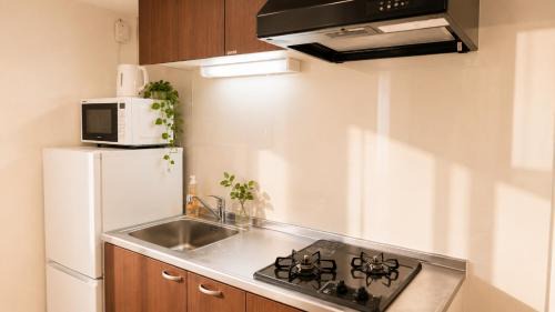 Fukushima Apartment | 605 電車でusjまで8分 梅田まで4分 利便性と上質な滞在を叶えるローカル空間