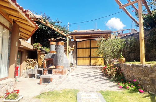 Huaran House | An intimate retreat in the Sacred Valley, with a sauna, hot tub, and views of a waterfall and the mountains