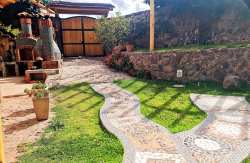 Huaran House | An intimate retreat in the Sacred Valley, with a sauna, hot tub, and views of a waterfall and the mountains