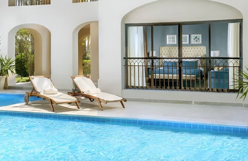 Village Road Resort | Bright Resort Room with Private Terrace, Pools, Beach Access & Entertainment