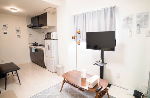 Shinsekai Apartment | Just outside of Namba! Tsutenkaku Tower can be seen from the corridor.