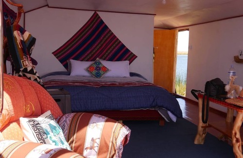 Puno Hotel | Little house on the floating islands of the Uros, Lake Titicaca, Puno-Peru