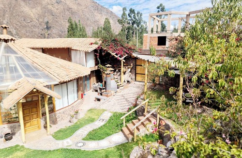 Calca Villa | Lodge in the Sacred Valley, Sauna, Hot Tub, Views of the Waterfall, Mountains, and the River.