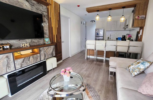 Barranco Apartment | Luxury apartment with a pool, ocean view, air conditioning, and a digital fireplace