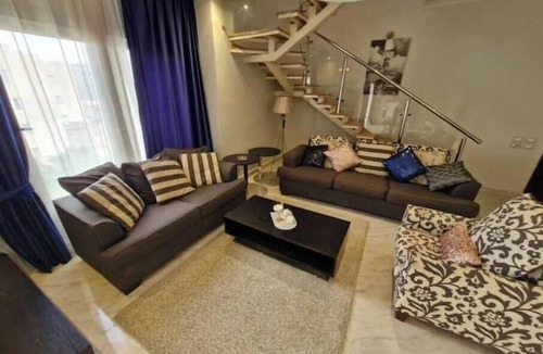 The 5th Settlement Apartment | Modern 3BR Apartment in The Village Compound | Near AUC | WiFi & Terrace