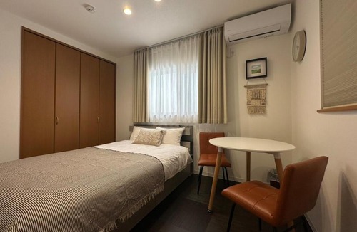 Nishi Villa | Nikyo Shine Inn Two parking spaces 4 bedrooms 7 minutes to Kujo Station 4 rooms, 2 bathrooms, private building