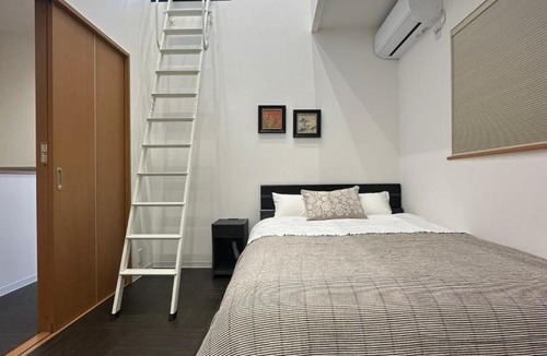 Nishi Villa | Nikyo Shine Inn Two parking spaces 4 bedrooms 7 minutes to Kujo Station 4 rooms, 2 bathrooms, private building