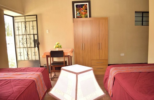 Yungar Cabin | Room with two single beds and a view of the mountains.