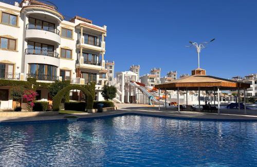 Ras Nasrani Apartment | Sharm Hills - 3BR with Pool & Aquapark View and Free Beach Access