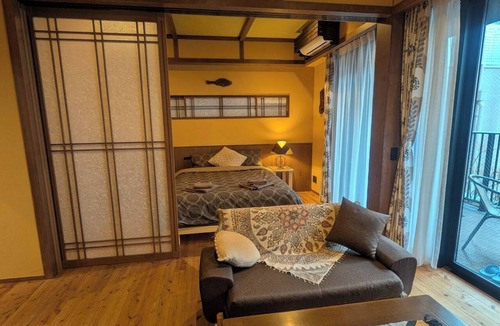 Minamisenba Apartment | Stylish Apartment with Balcony, Walk to Dotonbori, Shinsaibashi, & Kuromon Mkt