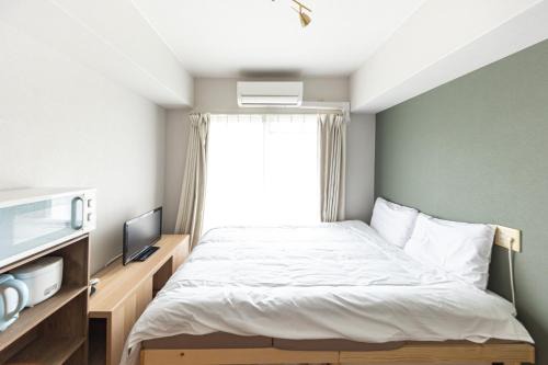 702 道頓堀側のお部屋 中心地へのアクセス抜群 ダブルベッド1台 in Osaka