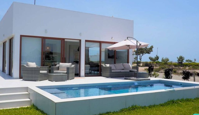 Beachfront Elegance: Private Pool & Steps to Shore in Chincha Baja