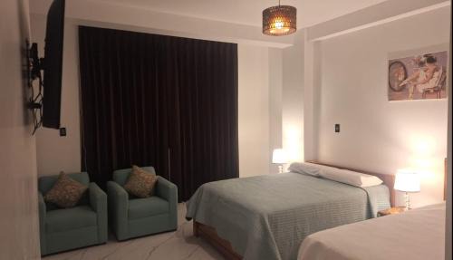 Habitación con WiFi TV Frigobar Ventilador a una cda de Plaza de Armas