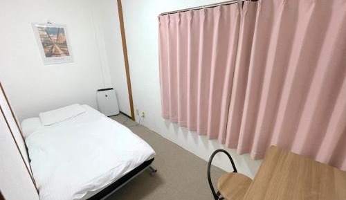 Single Bed in Dormitory Room
